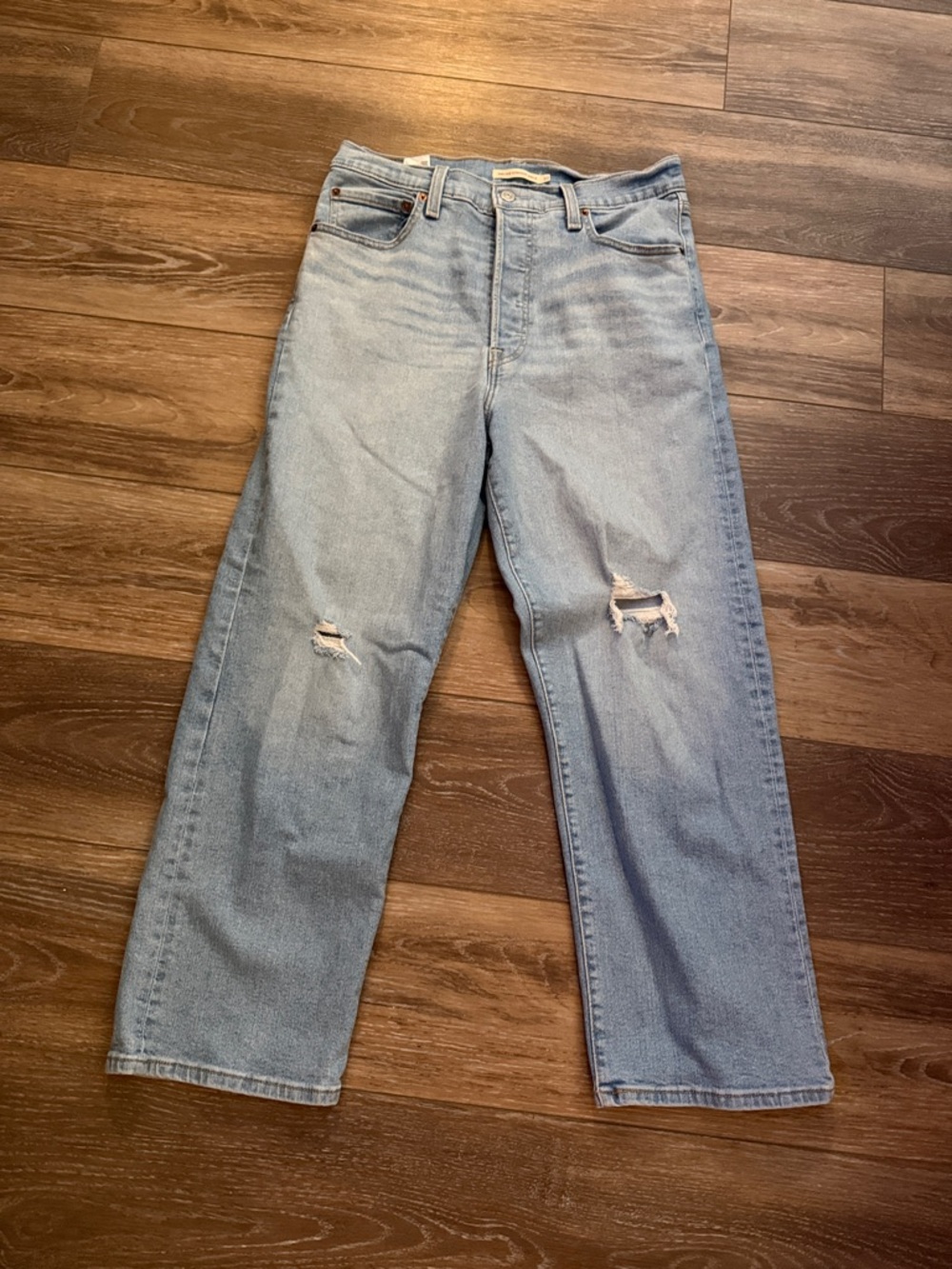 Levi's High-Rise Light Blue Straight Jeans with Knee Rips